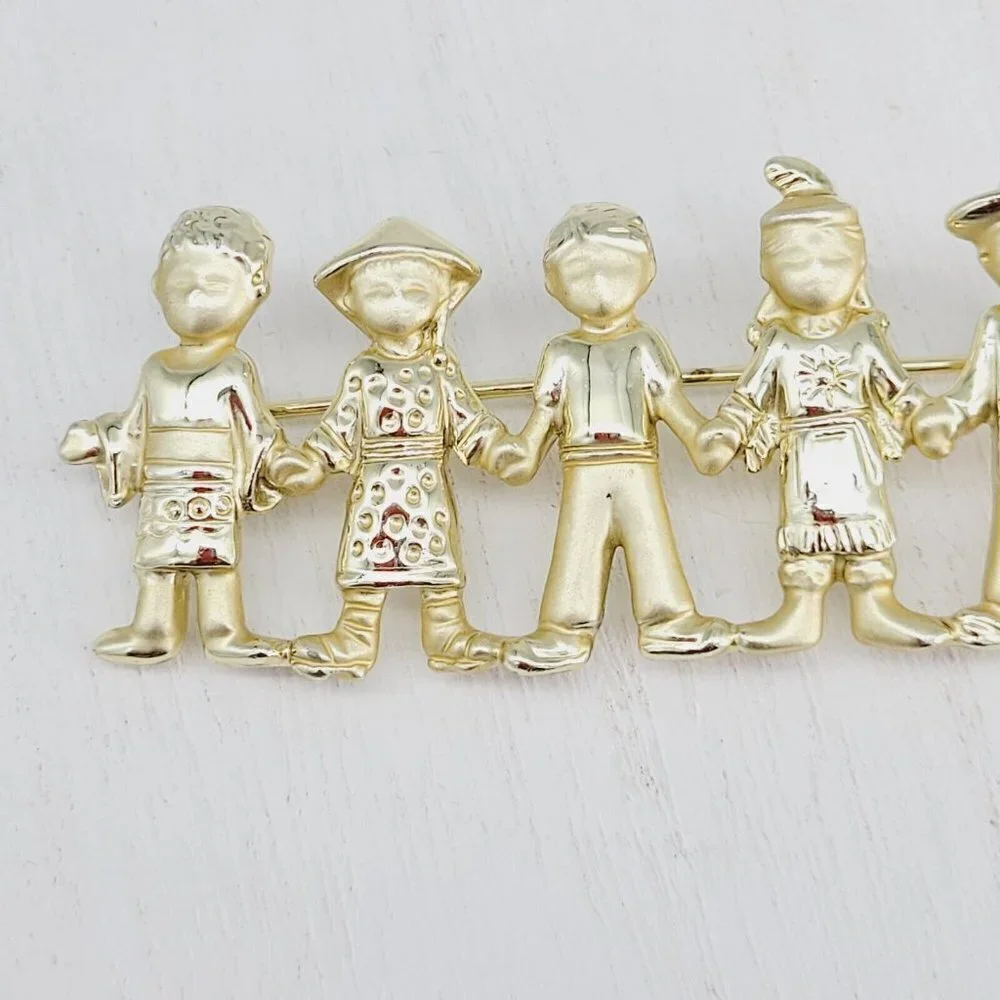 AJC American Jewelry Co. Children Of The World Brooch Satin & Polished Gold Tone